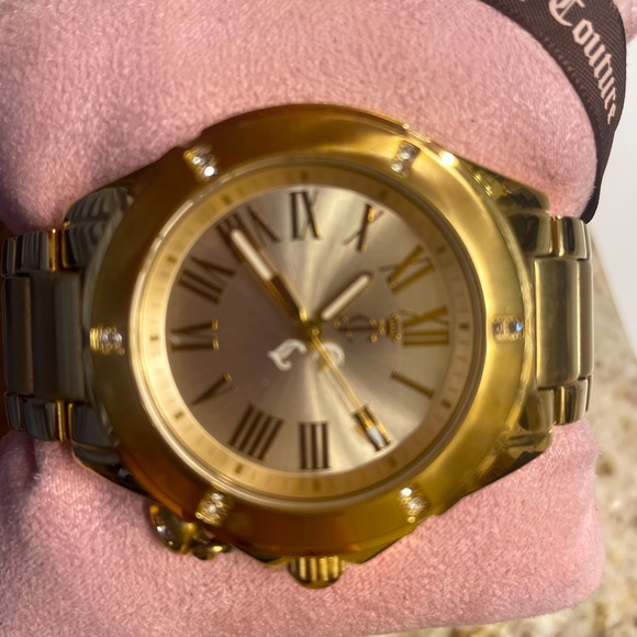 Beautiful timeless gold Juicy couture watch on a Movado band. - Picture 1 of 3